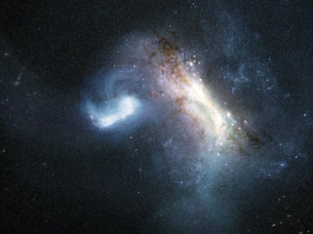 Representación artística de la colisión entre una galaxia enana conocida como LKH (izquierda) y una Vía Láctea joven (derecha), hace unos 12.000 millones de años. Crédito: Representación artística de la colisión entre una galaxia enana conocida como LKH (izquierda) y una Vía Láctea joven (derecha), hace unos 12.000 millones de años.