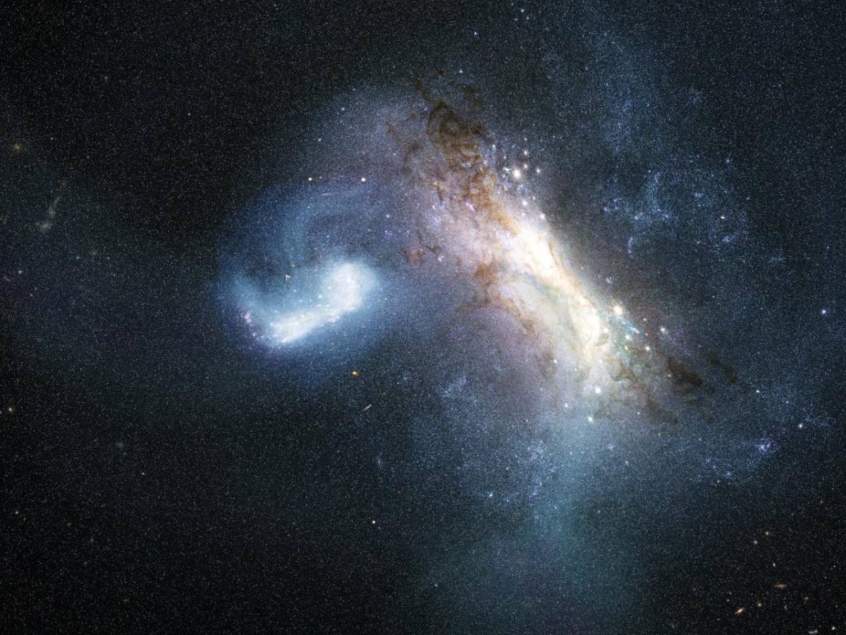 Representación artística de la colisión entre una galaxia enana conocida como LKH (izquierda) y una Vía Láctea joven (derecha), hace unos 12.000 millones de años. Crédito: Representación artística de la colisión entre una galaxia enana conocida como LKH (izquierda) y una Vía Láctea joven (derecha), hace unos 12.000 millones de años.